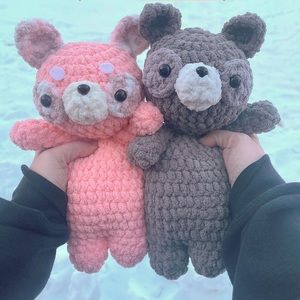 crocheted pink or grey raccoon
